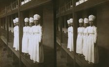 Japanese nurses attending to wounded soldiers in a hospital ward, c1905. Creator: Underwood & Underwood
