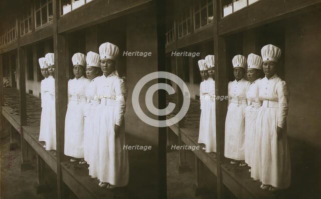 Japanese nurses attending to wounded soldiers in a hospital ward, c1905. Creator: Underwood & Underwood.