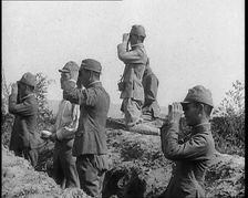 Japanese Soldiers in a Trench Looking Through Binoculars, 1937. Creator: British Pathe Ltd