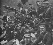 Japanese soldiers on the way to the front: the noonday meal of tea and rice, 1904-1905 (1907)