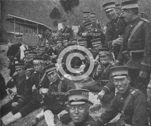 Japanese soldiers on the way to the front: the noonday meal of tea and rice, 1904-1905 (1907). Artist: Unknown.