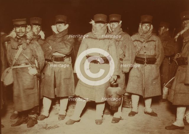 Japanese soldiers landed at Chemulpo after naval battle, waiting on a beach to entrain..., c1904. Creator: Robert Lee Dunn.