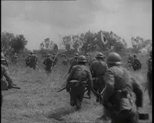 Japanese Soldiers Running Through a Field, 1933. Creator: British Pathe Ltd