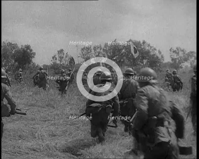 Japanese Soldiers Running Through a Field, 1933. Creator: British Pathe Ltd.