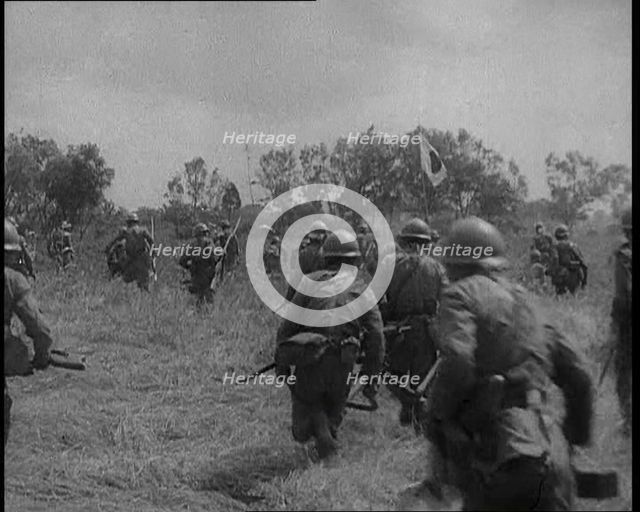 Japanese Soldiers Running Through a Field, 1933. Creator: British Pathe Ltd.