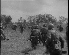 Japanese Soldiers Running Through a Field, 1933. Creator: British Pathe Ltd