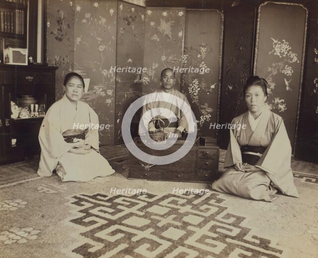 Japanese servants O Hero San, O Eun San, and O Sok San with tea utensils in the..., 1899. Creator: Eleanor Lord Pray.
