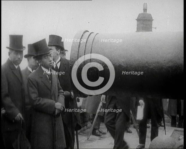Japanese Prince Regent Hirohito Inspecting a Large Cannon With Japanese Dignitaries on the..., 1921. Creator: British Pathe Ltd.