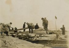 Japanese removing timbers from lighters at Chemulpo for erection of runways, c1904. Creator: Robert Lee Dunn
