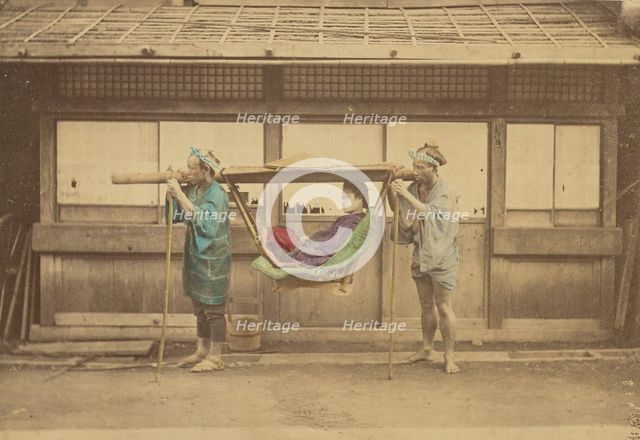 Japanese woman being carried by two Japanese men in a kago, 1868-1880. Creator: Felice Beato.