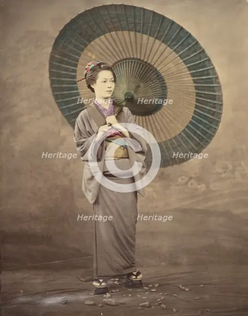 Japanese woman holding a large parasol, 1868-1880. Creator: Felice Beato.