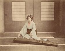 Japanese Woman Playing a Koto, 1865-1875. Creator: Unknown