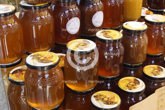 Jars of honey on a market stall, Mallorca, Spain.