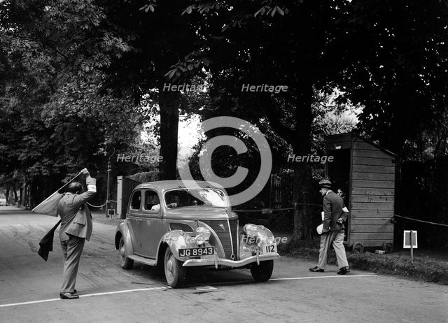 JB Thompson's Ford V8 on the way to winning bronze in the MCC Torquay Rally, July 1937. Artist: Bill Brunell.