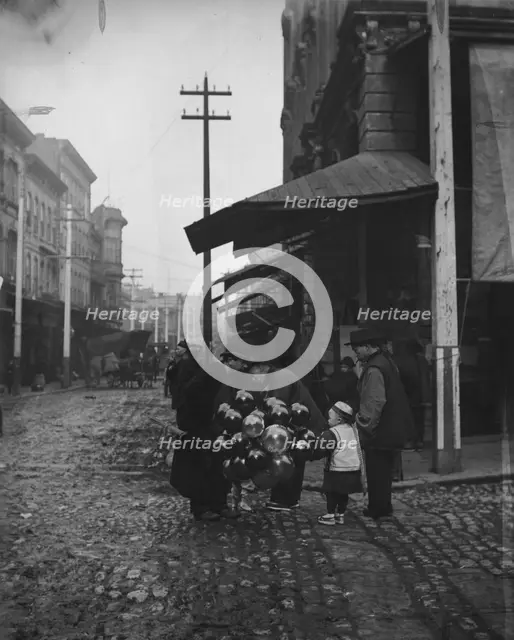 Jewish balloon man, Chinatown, San Francisco, between 1896 and 1906. Creator: Arnold Genthe.
