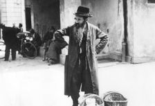 Jewish peddler selling potatoes, Warsaw Ghetto, Poland, World War II, 1940-1945. Creator: Unknown