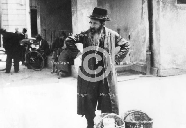 Jewish peddler selling potatoes, Warsaw Ghetto, Poland, World War II, 1940-1945. Creator: Unknown.