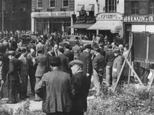 Jewish tailors looking for employment, Whitechapel Road, London, c1940s. Creator: Unknown