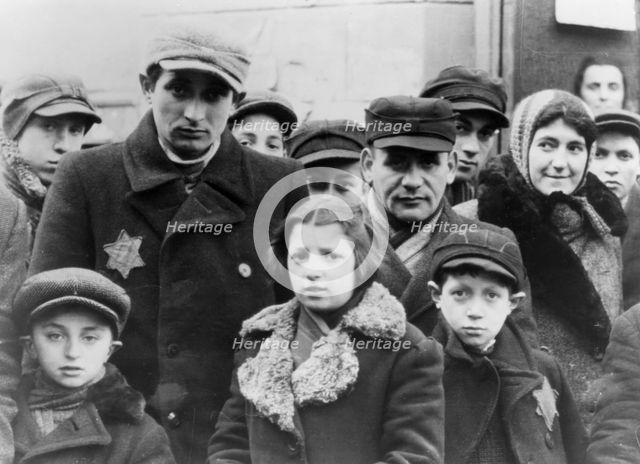 Jews wearing Star of David badges, Lodz Ghetto, Poland, 1940-1944. Creator: Unknown.