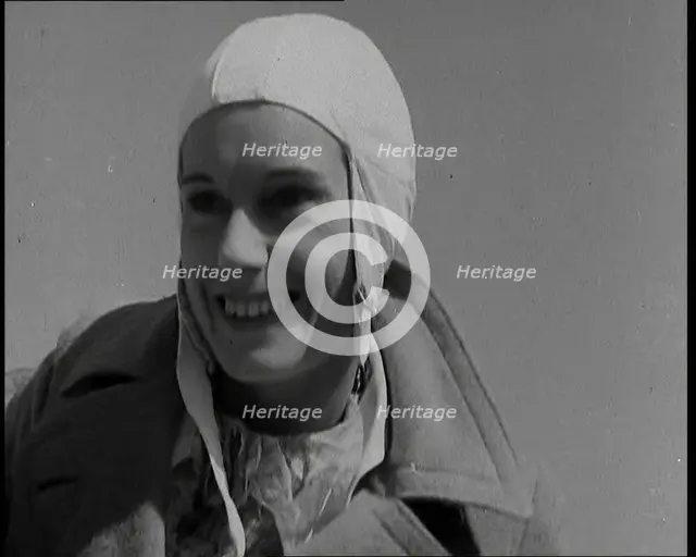 Jean Batten in Flying Gear Smiling to Crowds, 1930s. Creator: British Pathe Ltd.