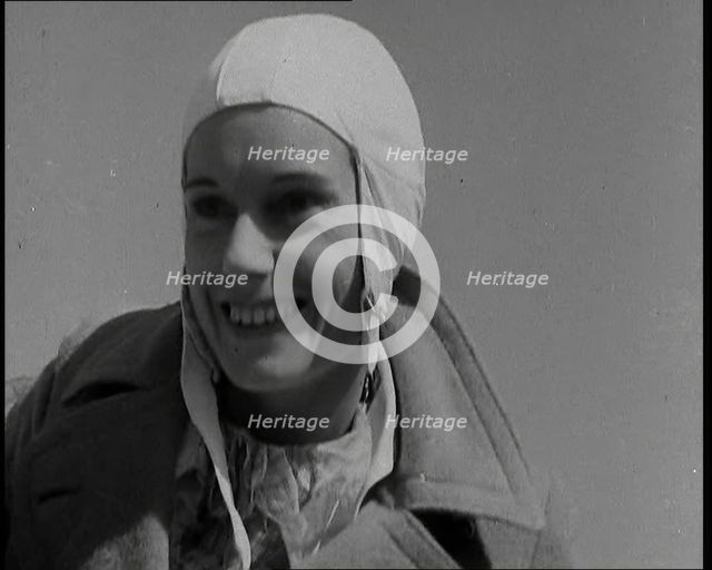 Jean Batten in Flying Gear Smiling to Crowds, 1930s. Creator: British Pathe Ltd.
