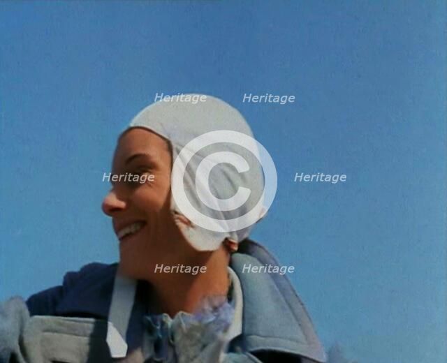 Jean Batten in Flying Gear Smiling to Crowds, 1930s. Creator: British Pathe Ltd.