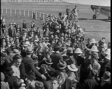 Jean Batten Walking Through a Crowd, 1930s. Creator: British Pathe Ltd