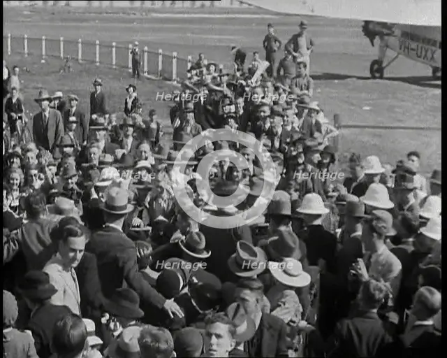 Jean Batten Walking Through a Crowd, 1930s. Creator: British Pathe Ltd.