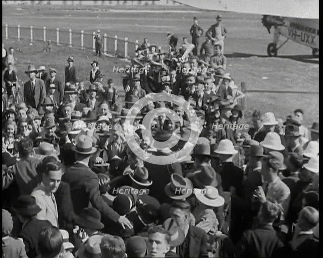 Jean Batten Walking Through a Crowd, 1930s. Creator: British Pathe Ltd.