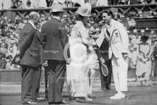 Jean Borotra receives his medal from Queen Mary on centre court, 1926. Artist: London News Agency