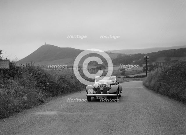 Jensen open 4-seater of Ken Crawford competing in the South Wales Auto Club Welsh Rally, 1937 Artist: Bill Brunell.