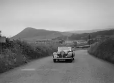 Jensen open 4-seater of Ken Crawford competing in the South Wales Auto Club Welsh Rally, 1937 Artist: Bill Brunell
