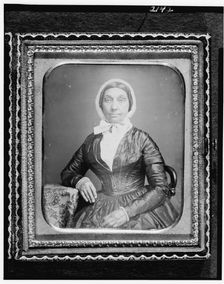 Jerusha Field, half-length portrait, seated in chair, with arm resting..., between 1840 and 1860. Creator: Unknown