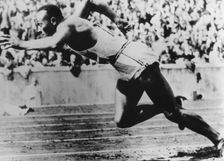 Jesse Owens, American athlete, competing in the Olympics in Berlin, Germany, 1936. Creator: Unknown