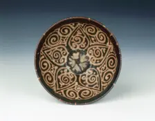 Jizhou bowl with stylised open flower, Yuan dynasty, China, late 13th-early 14th century. Creator: Unknown