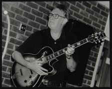Jim Mullen playing guitar at The Fairway, Welwyn Garden City, Hertfordshire, 3 August 1997. Creator: Denis Williams