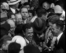 Jim Mollison Walking Surrounded by a Large Crowd, 1930s. Creator: British Pathe Ltd