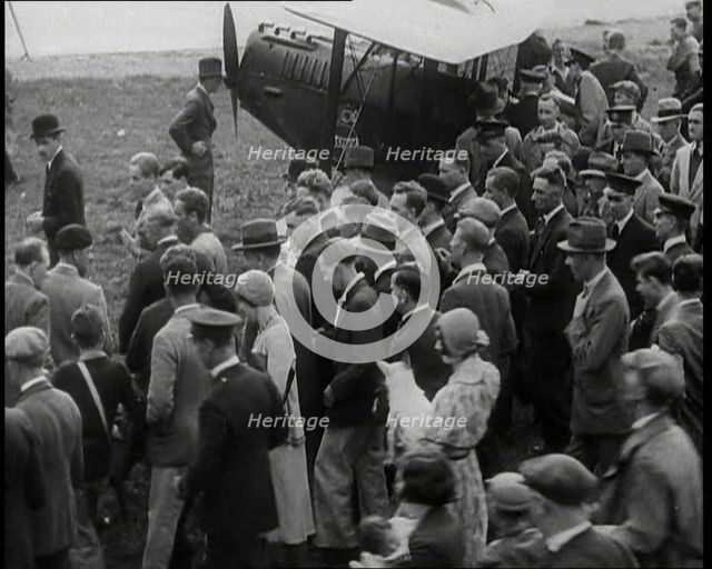 Jim Mollison Walking to His Plane With a Large Crowd, 1930s. Creator: British Pathe Ltd.