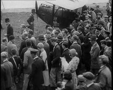 Jim Mollison Walking to His Plane With a Large Crowd, 1930s. Creator: British Pathe Ltd