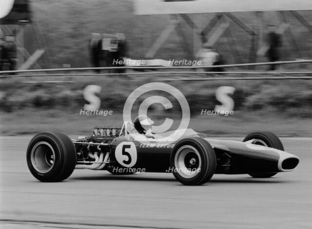 Jim Clark driving the Lotus 49 at the British Grand Prix, Silverstone, 1967. Artist: Unknown