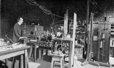 JJ Thomson, British physicist, at work in the Cavendish Laboratory, Cambridge