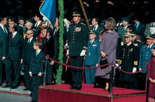 Juan Carlos I, King of Spain, with Queen Sofia and Prince Felipe, presiding over a military parad…