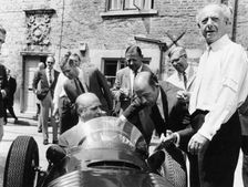 Juan Manuel Fangio at the wheel of a V16 BRM, (1960s?)