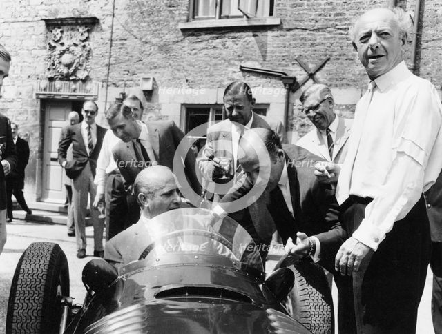 Juan Manuel Fangio at the wheel of a V16 BRM, (1960s?). Artist: Unknown