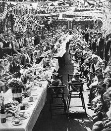 Jubilee tea party for children in Orville Road, Battersea, London, 1935
