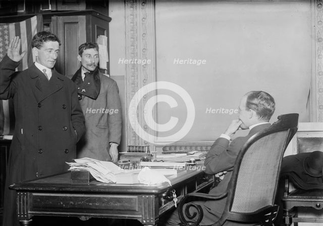 Judge in chambers swearing in a new citizen, New York, 1910. Creator: Bain News Service.
