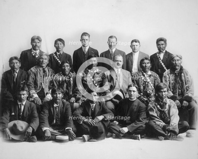 Judge James Wickersham in council with Indian chiefs, between 1900 and 1907. Creator: Unknown.