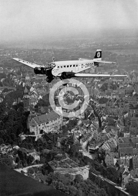 Junkers Ju 52 aircraft D-2600 over Nuremberg, Germany, 1934. Artist: Unknown