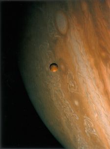 Jupiter and Io, one of its moons, 1979. Creator: Unknown