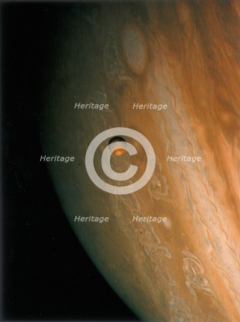 Jupiter and Io, one of its moons, 1979.  Creator: Unknown.